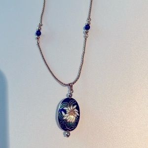 𝅺avon  cloisonné blue floral with gold tone beaded chain.